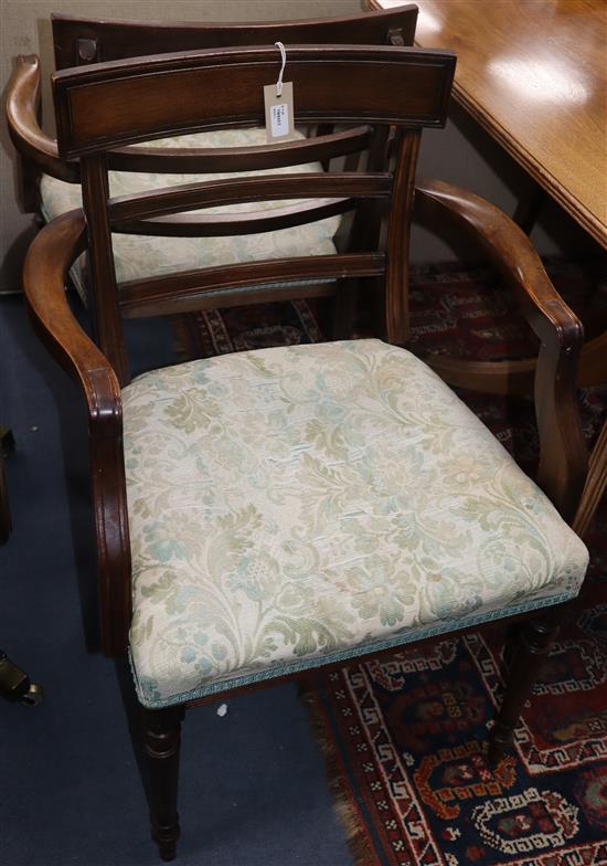 A set of six Regency mahogany dining chairs and a pair of later matching William Tillman open armchairs